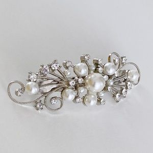 Faux pearls and rhinestones silver hair barrette.